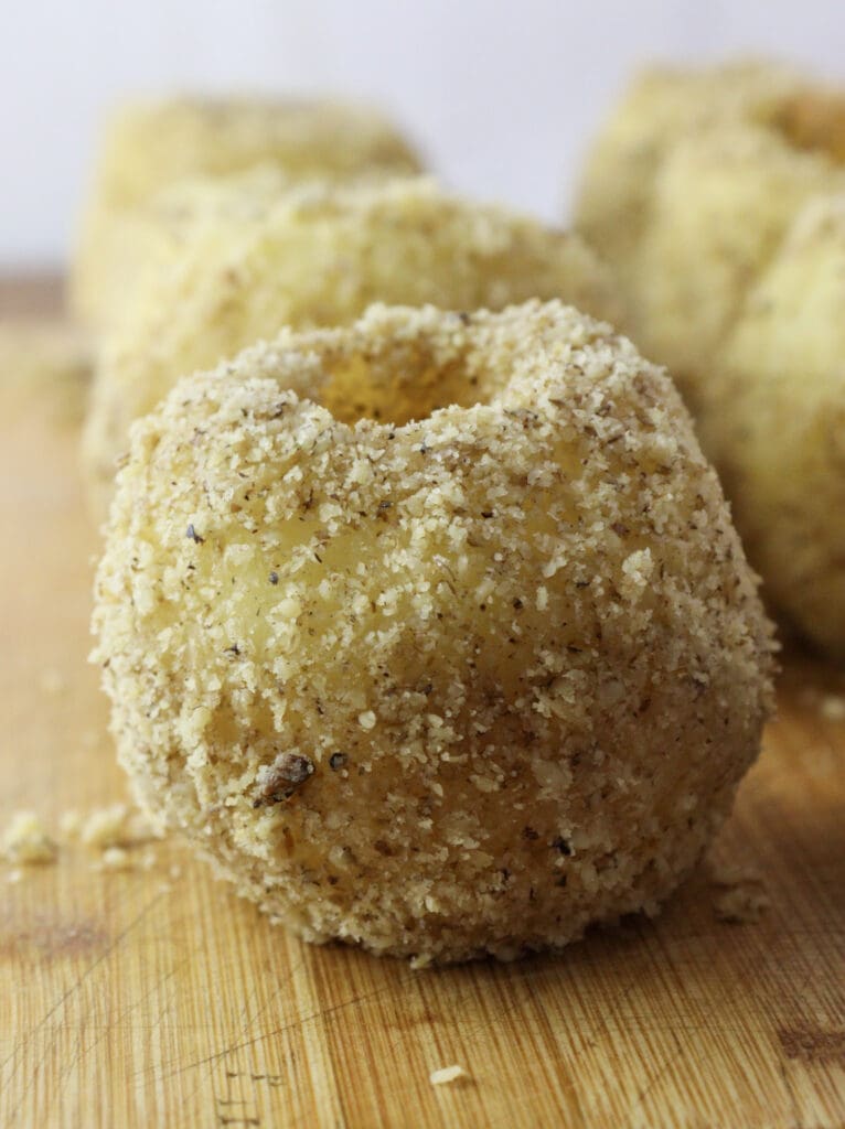 Antoher cooked apple rolled in ground walnuts.